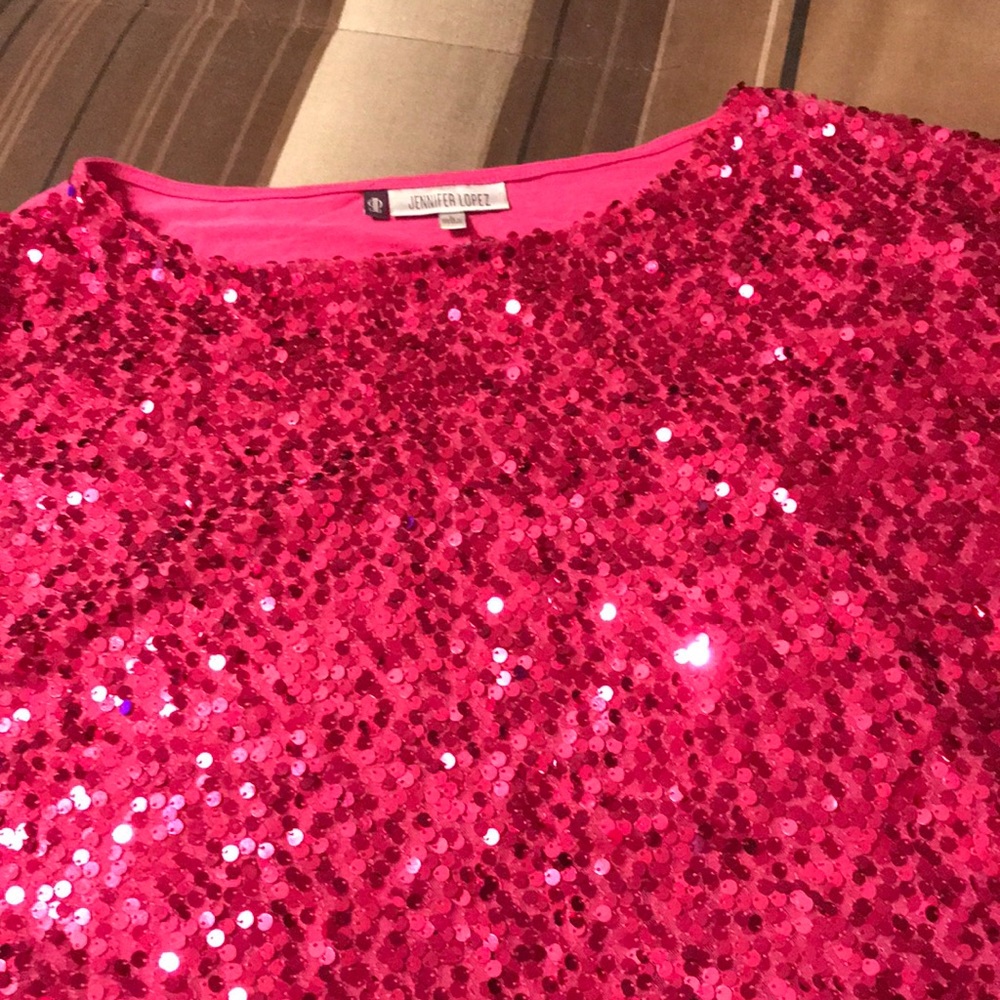 Sequined pink top.